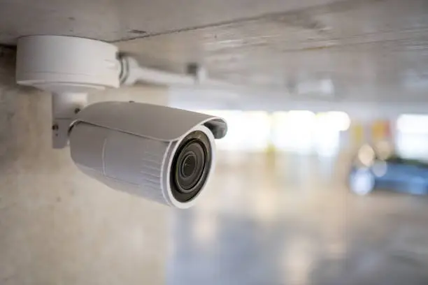 A photo of a CCTV camera installed on a wall