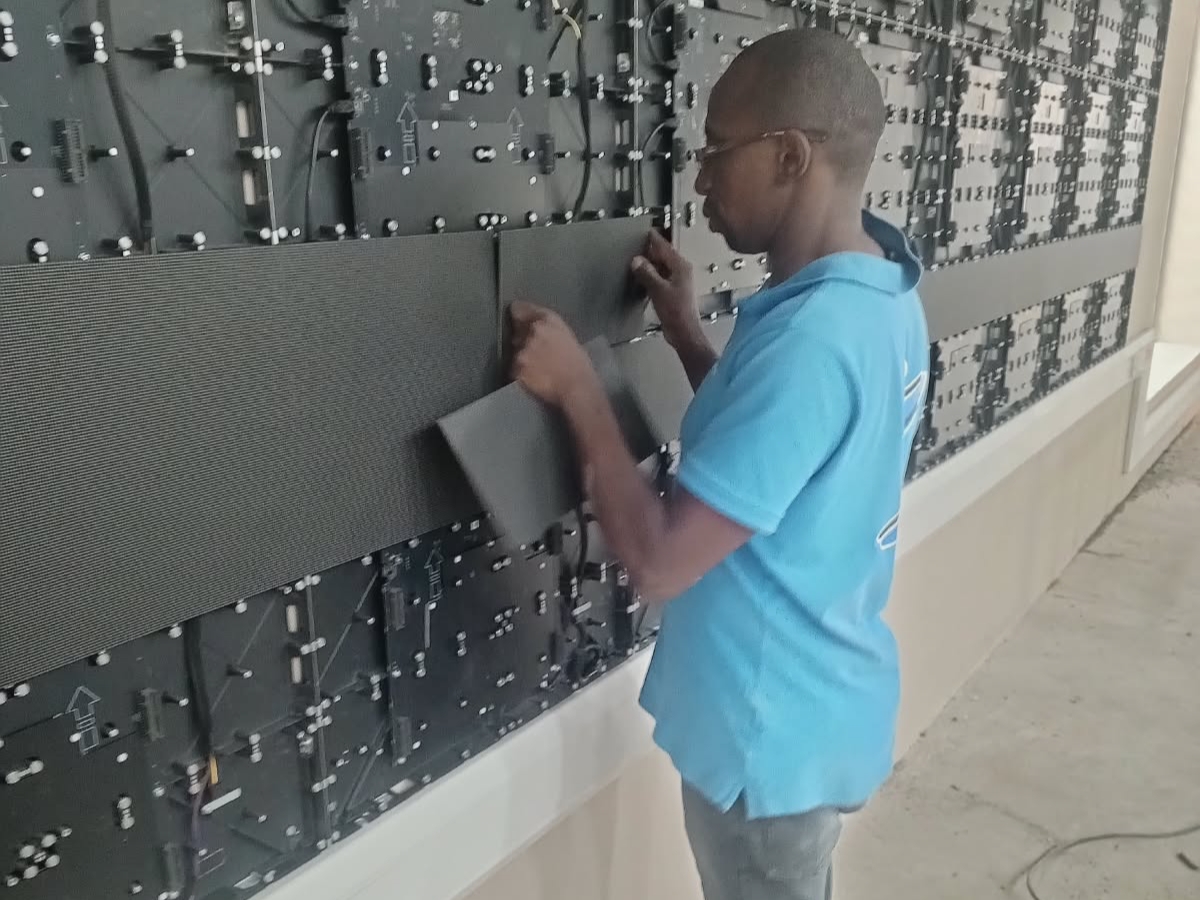 Technician installing LED Modules