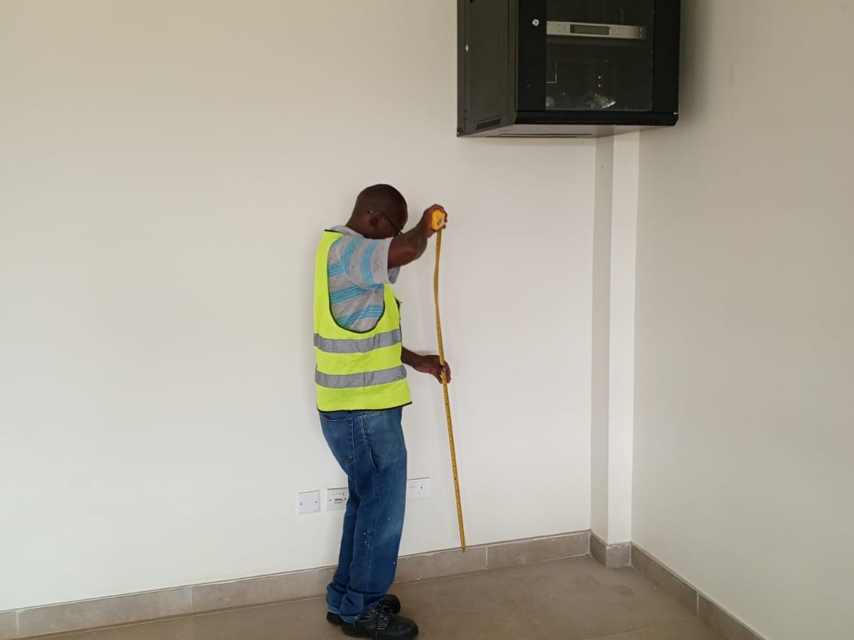 Technician taking measurements
